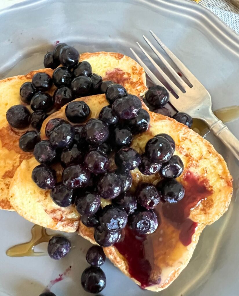 Blackstone french toast topped with Blueberries and maple syrup. 