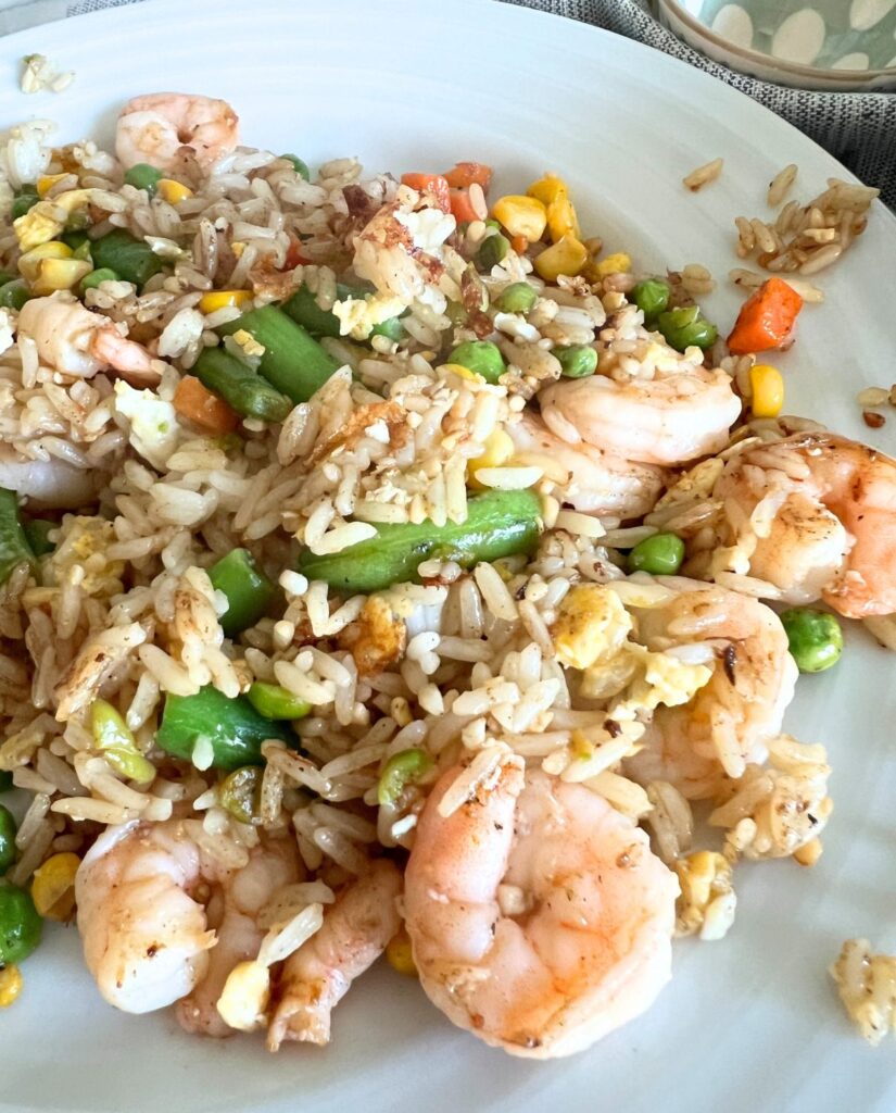 Blackstone shrimp fried rice on a white plate. 