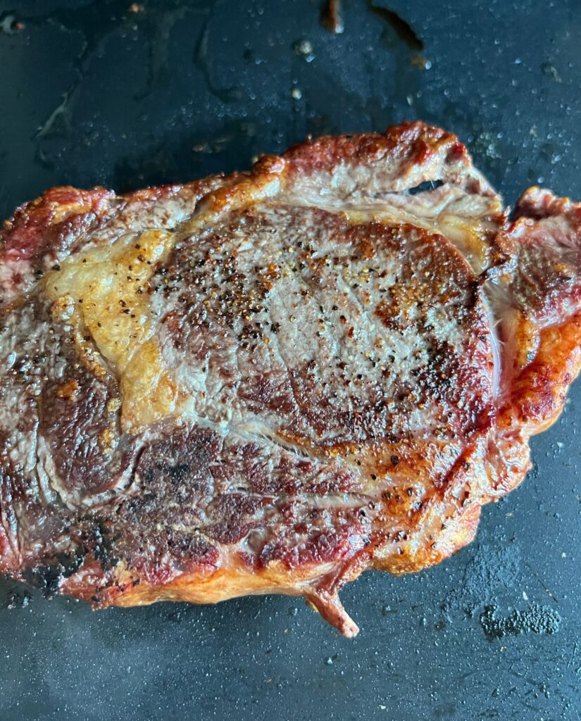Seasoned steak cooked on a Blackstone Griddle. 
